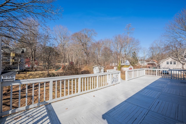 deck featuring an outbuilding and a storage shed