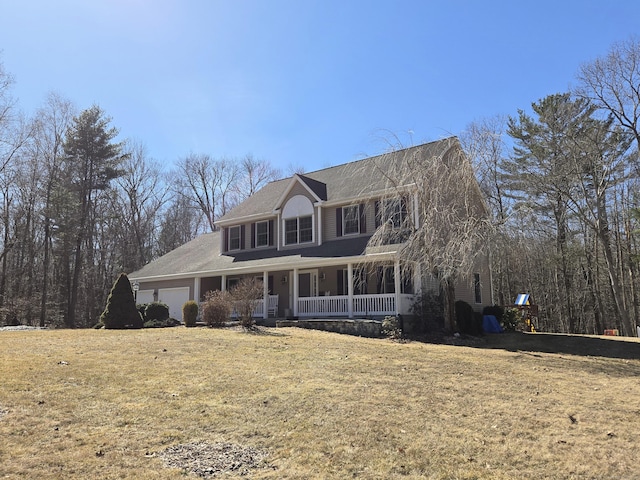 view of front of property featuring a garage and a porch