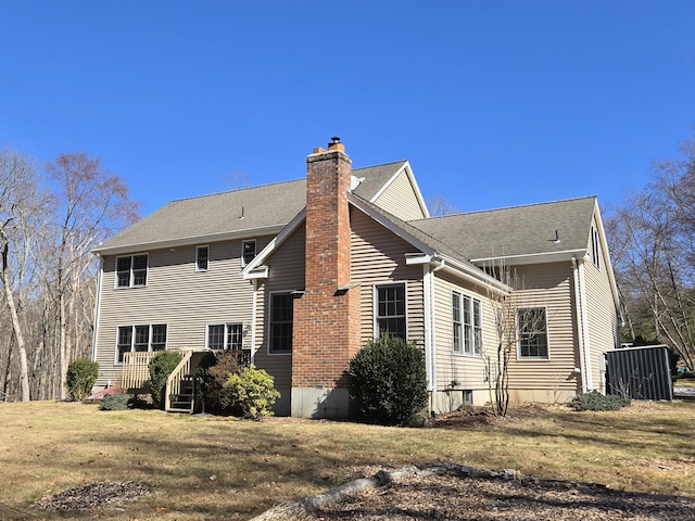 back of property with a chimney