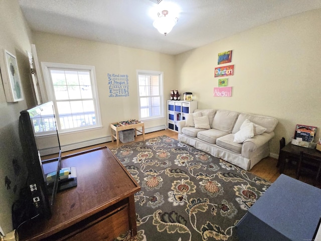 living room with baseboards and wood finished floors