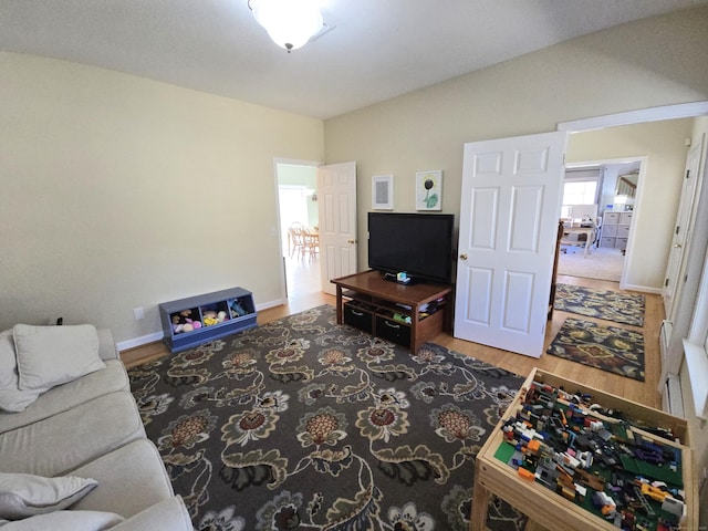 living area featuring wood finished floors and baseboards