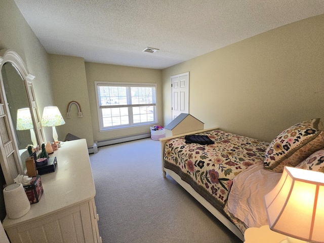 bedroom with a textured ceiling, carpet flooring, visible vents, and a baseboard radiator