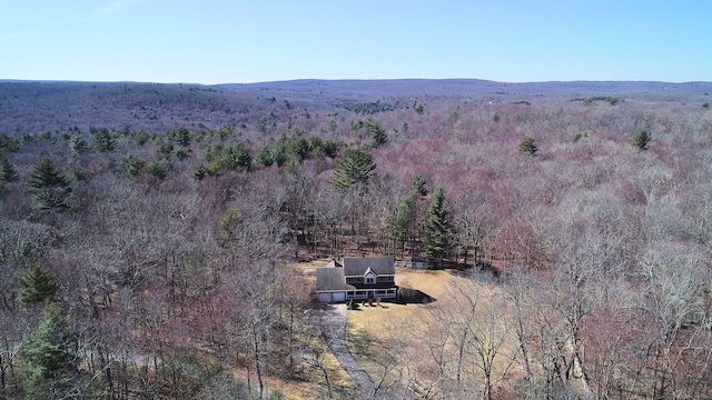 birds eye view of property with a wooded view