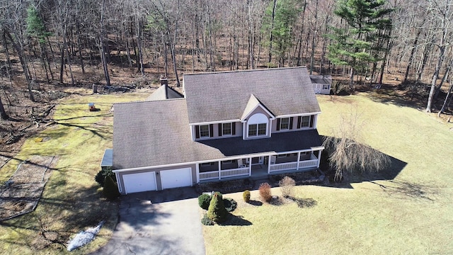 drone / aerial view with a view of trees