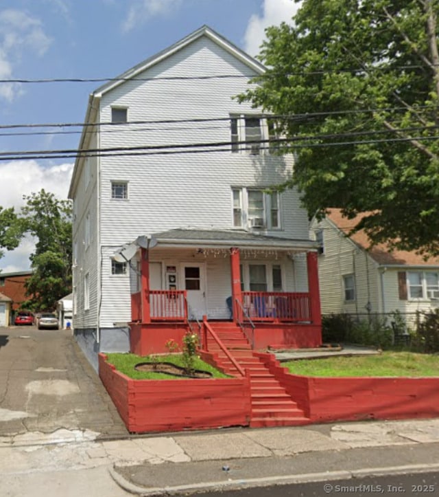 view of front facade with covered porch and stairs