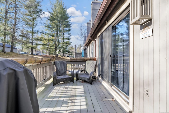 wooden deck featuring area for grilling