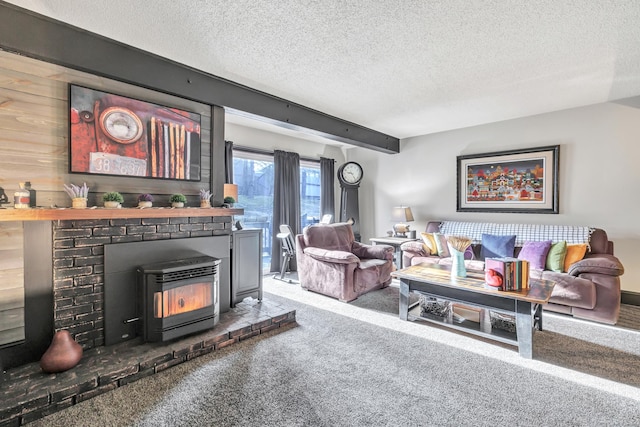 carpeted living room with beamed ceiling, a textured ceiling, and a wood stove