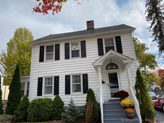 colonial home with a chimney