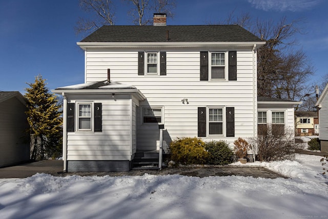 view of front of home with a chimney