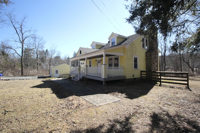 view of home's exterior featuring covered porch