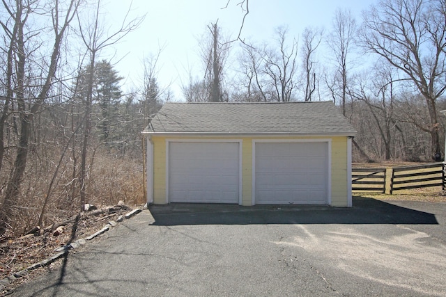 detached garage with fence