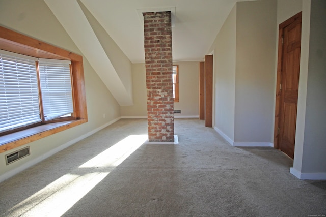 additional living space featuring carpet flooring, baseboards, and visible vents