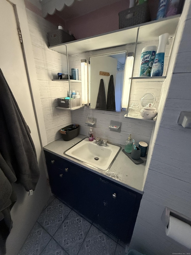 bathroom featuring tile patterned flooring, backsplash, and vanity