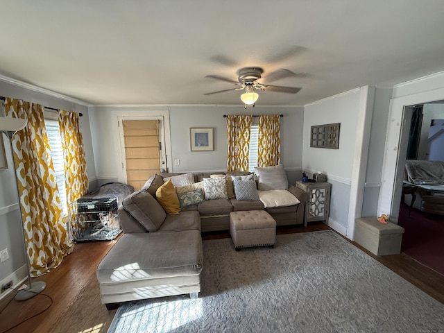 living room with a ceiling fan, a healthy amount of sunlight, wood finished floors, and crown molding