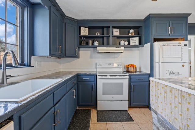 kitchen featuring under cabinet range hood, blue cabinets, white appliances, and a sink