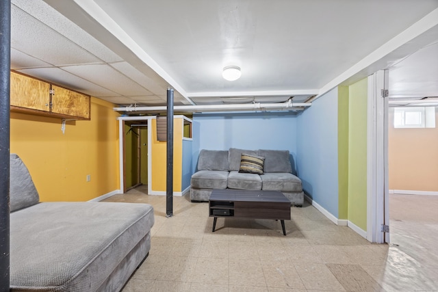 bedroom with light floors and baseboards