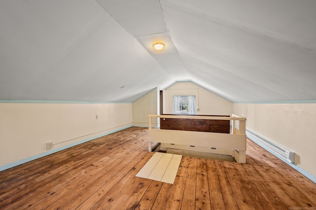 bonus room with hardwood / wood-style floors, lofted ceiling, and a baseboard radiator