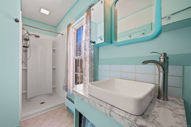 full bathroom featuring vanity and a shower stall