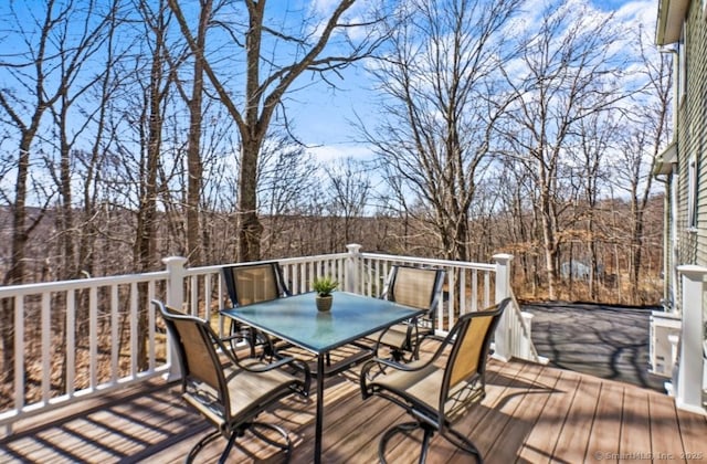 wooden deck featuring outdoor dining space