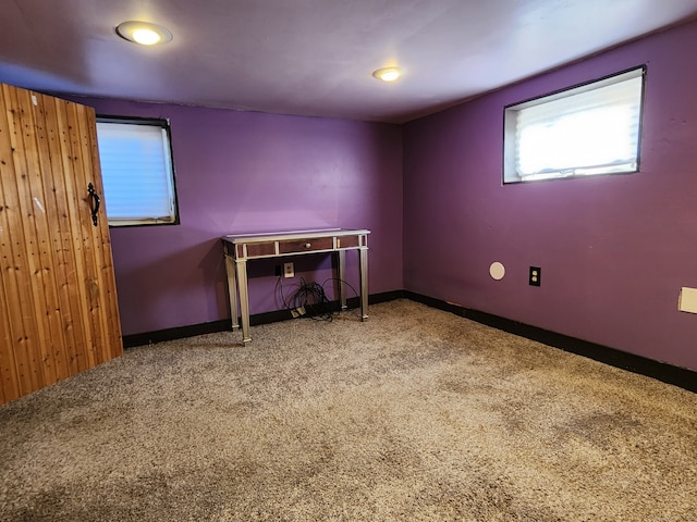 unfurnished bedroom with baseboards and carpet