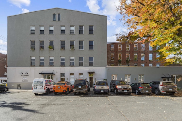 view of property with uncovered parking