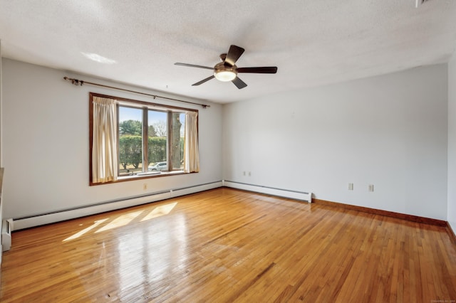 empty room with baseboards, a textured ceiling, light wood-style flooring, and a ceiling fan