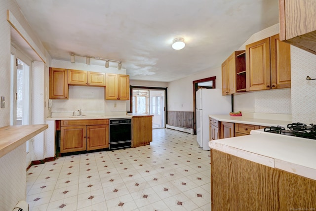 kitchen with a wainscoted wall, a baseboard radiator, freestanding refrigerator, light countertops, and black dishwasher