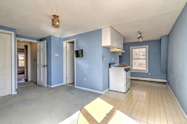 kitchen with a baseboard radiator, white cabinetry, baseboards, and gas range oven