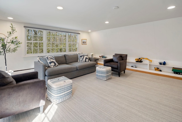 living area with a baseboard heating unit and recessed lighting