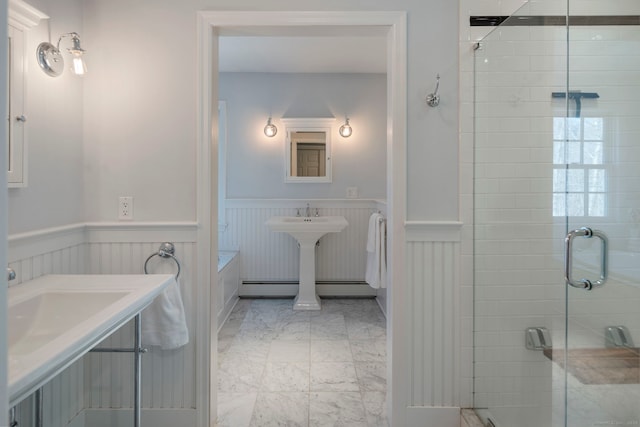 bathroom with a wainscoted wall, a baseboard radiator, a stall shower, a bath, and marble finish floor