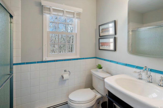 bathroom with an enclosed shower, a wainscoted wall, toilet, tile walls, and vanity