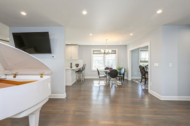 interior space featuring recessed lighting, baseboards, a chandelier, and dark wood-style flooring