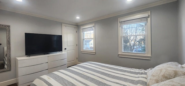 bedroom featuring crown molding, multiple windows, and recessed lighting