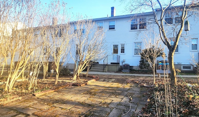 back of property with central air condition unit