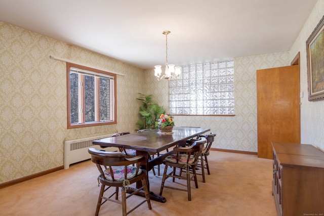 dining space featuring wallpapered walls, baseboards, radiator heating unit, light carpet, and a notable chandelier