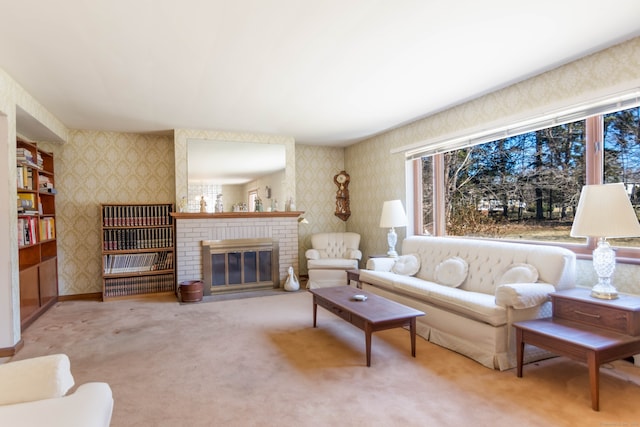 living area featuring a brick fireplace, wallpapered walls, baseboards, and carpet floors