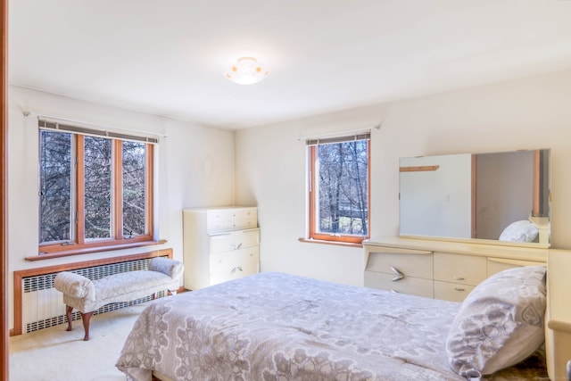 carpeted bedroom with radiator