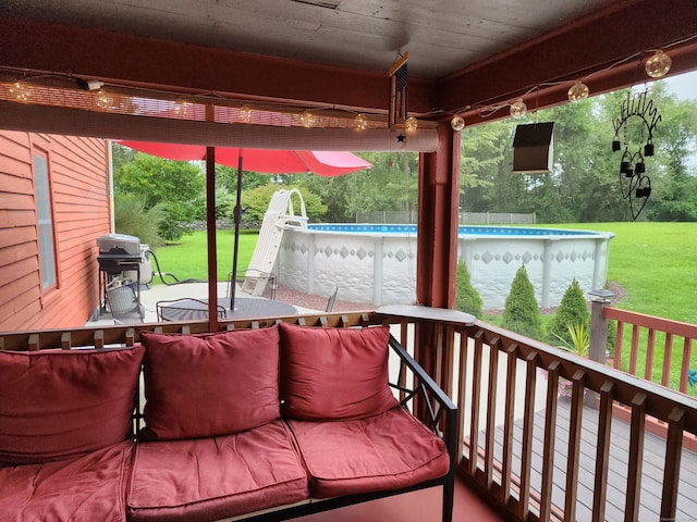 view of patio / terrace featuring area for grilling and an outdoor pool