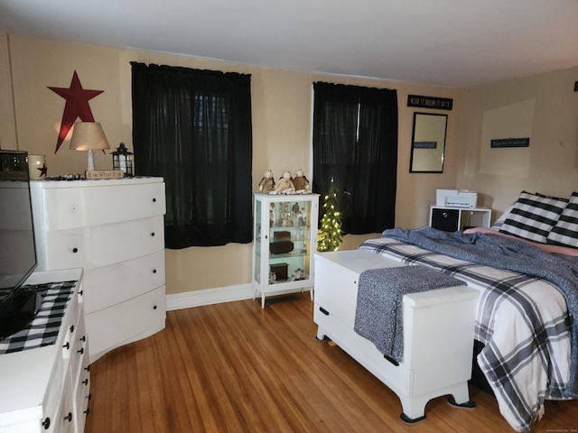 bedroom featuring wood finished floors