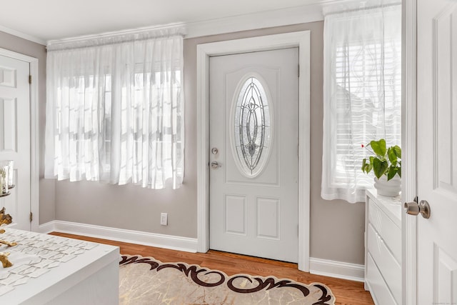 entrance foyer featuring light wood-type flooring and baseboards