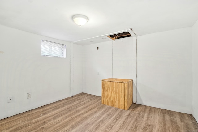 basement featuring light wood finished floors