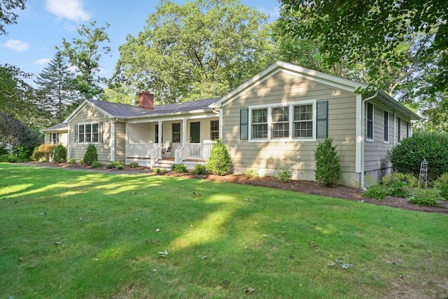 single story home with a front lawn, a porch, and a chimney