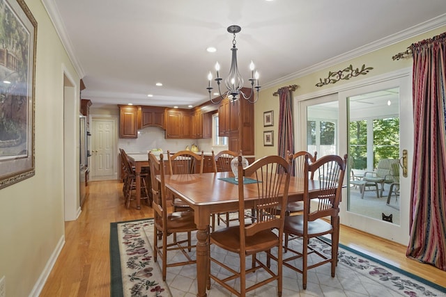 dining space featuring crown molding, baseboards, recessed lighting, light wood-style flooring, and a notable chandelier