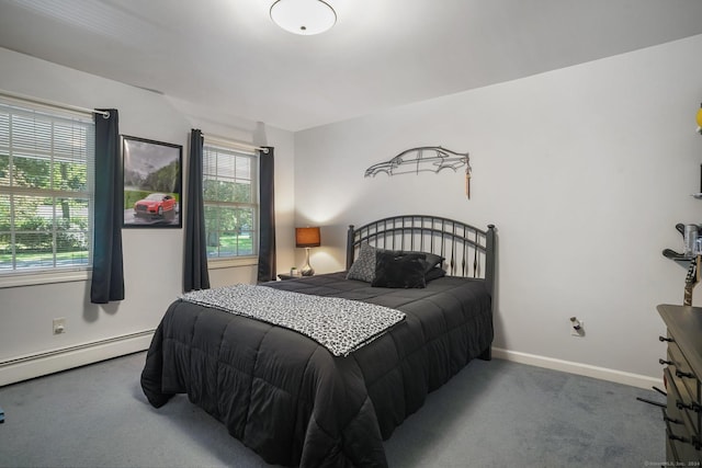 carpeted bedroom featuring a baseboard radiator and baseboards