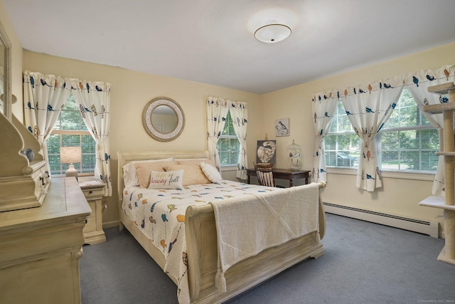 bedroom with multiple windows, carpet, and a baseboard radiator