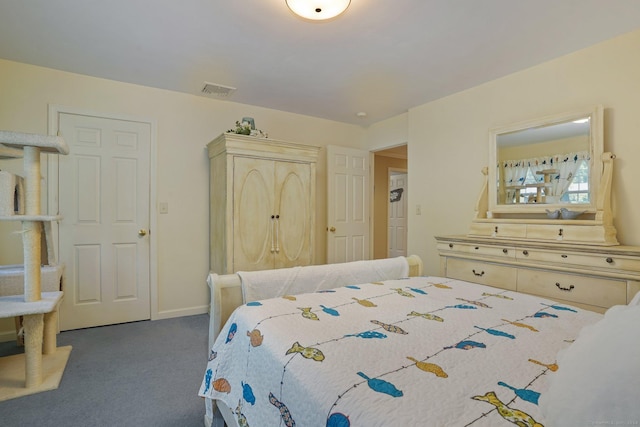 carpeted bedroom featuring visible vents and baseboards