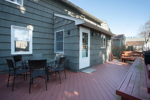 wooden deck with outdoor dining space