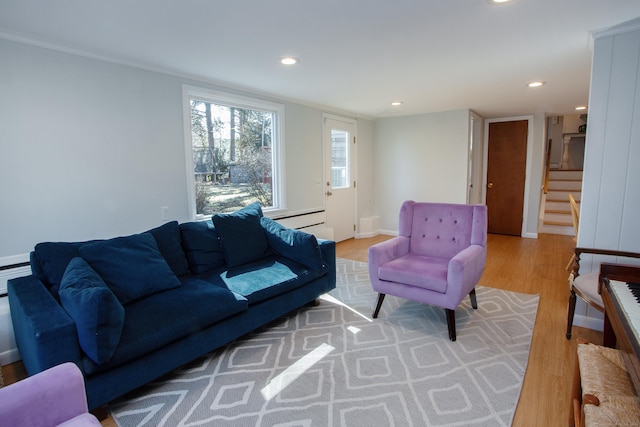 living room with recessed lighting, stairway, baseboards, and wood finished floors