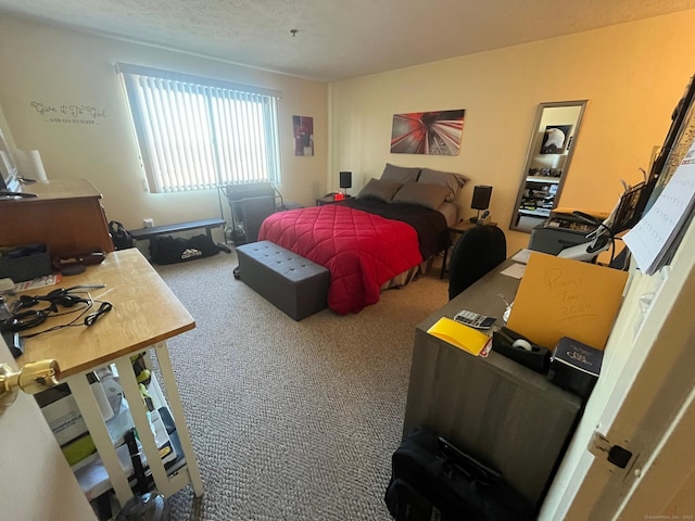 carpeted bedroom featuring a textured ceiling