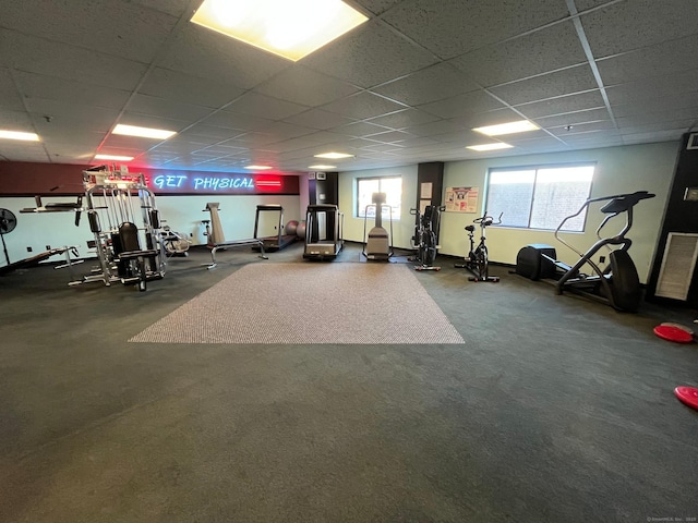 workout area with a paneled ceiling